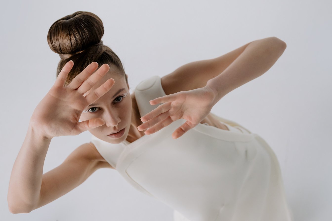 Woman in White Sleeveless Dress Shirt